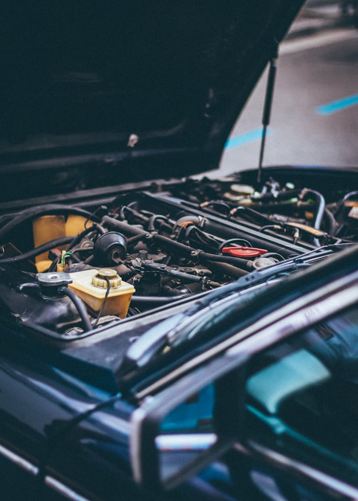Imagen actual: Detailed view of an exposed car engine under maintenance in Barcelona.