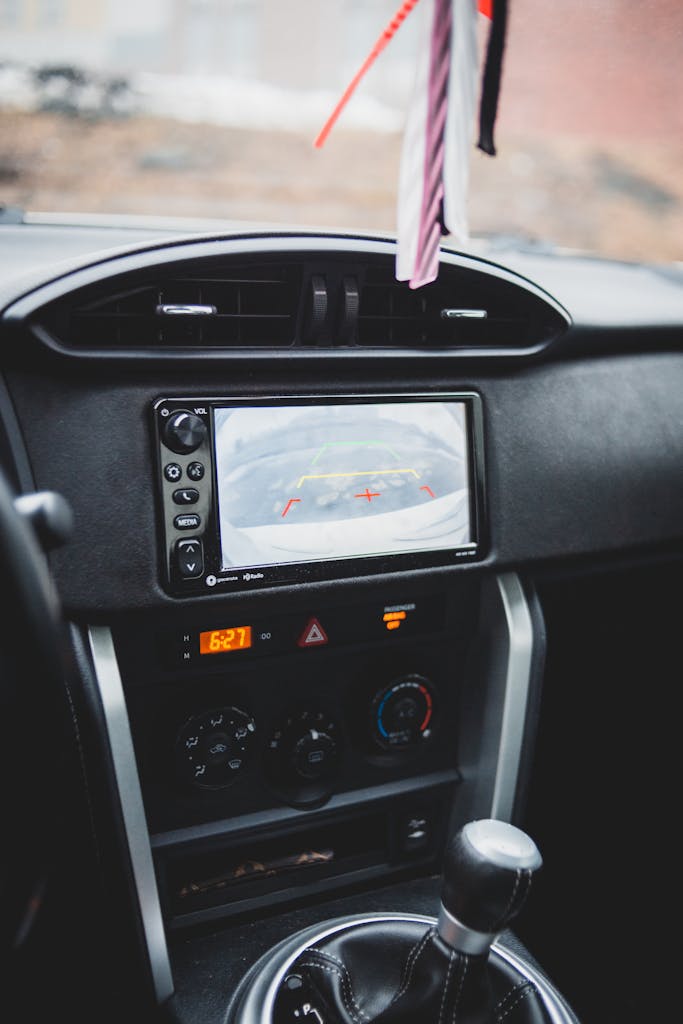 Imagen actual: Modern dashboard of car with navigation display combined with multimedia system and selector